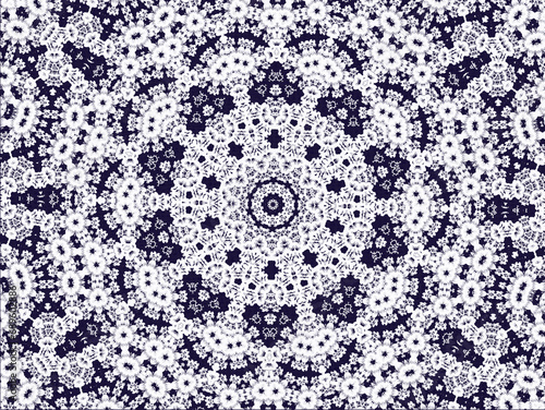 Black and white background with a floral design similar to a mandala or lace. 