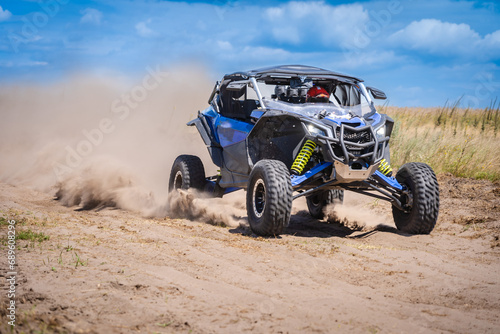 UTV in action offroad vehicle racing on sand dune. Extreme, adrenalin. 4x4.