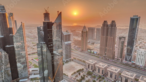 Photography High-rise buildings on Sheikh Zayed Road in Dubai aerial timelapse during sunset, UAE