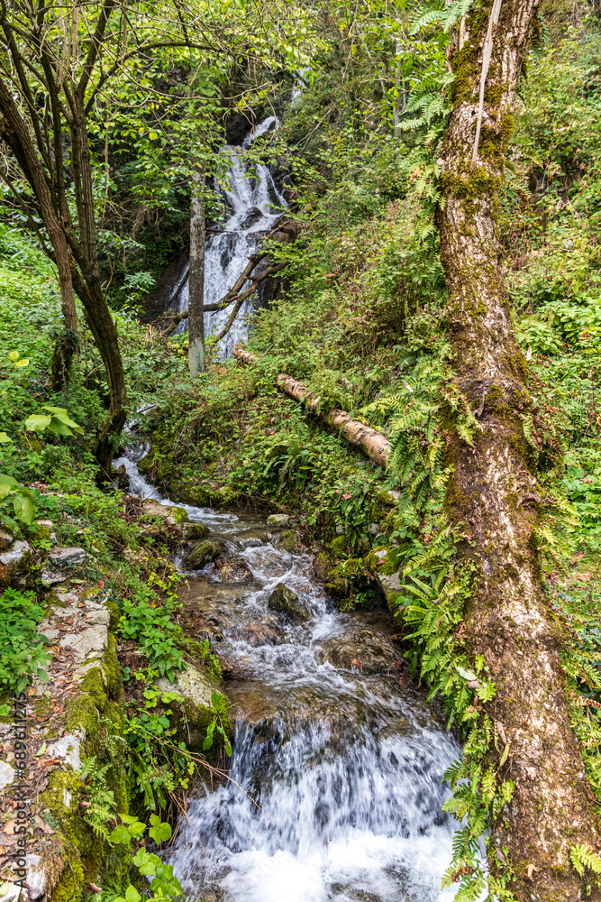 Creek and huge waterfall in mountain at Tolmin in Slovenia. Creek and huge waterfall in mountain at Tolmin in Slovenia.