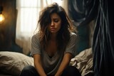 Sad and crying female, Woman Suffering From Depression Sitting On Bed.