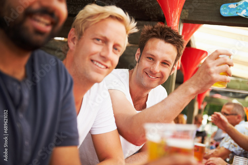 Happy man, friends and drinking at music festival, cafe or event for summer party or DJ concert. Portrait of male person smile with alcohol or beer for friendship at carnival or outdoor bar stand