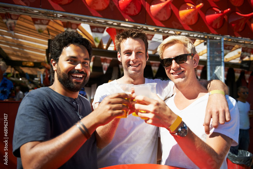 Happy man, friends and cheers at music festival, bar or event for summer party or DJ concert. Portrait of male person or group smile with beer toast for friendship at carnival or outdoor cafe stand