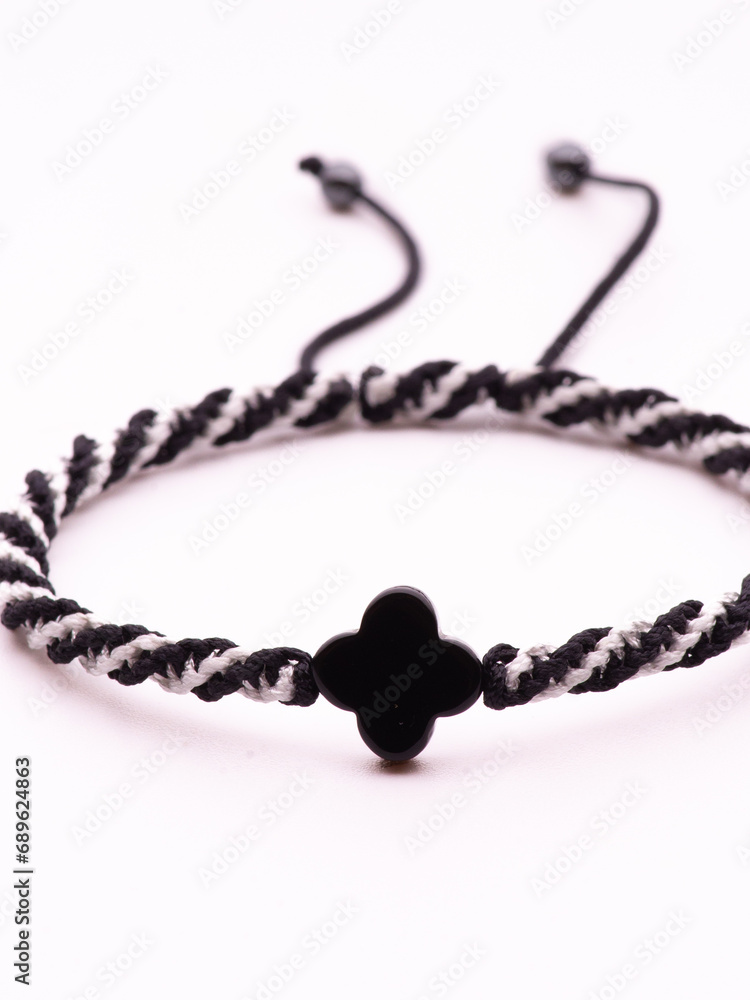 Buddhist bracelet shamballa with gems on a white background Buddhist bracelet shamballa with gems on a white background