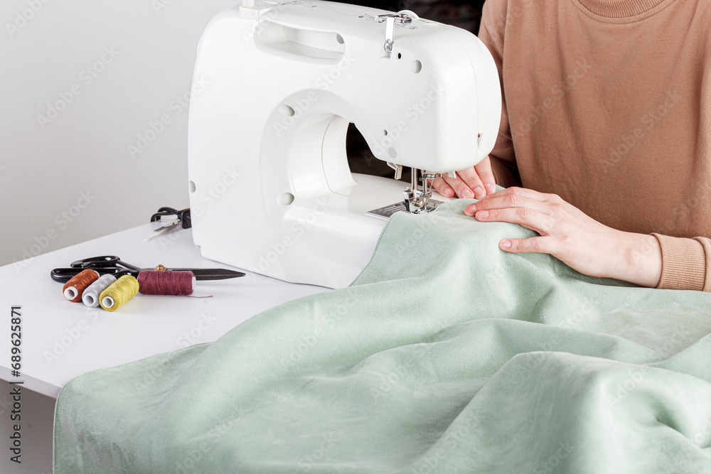 Sewing machine, stitching fabrics, needle in a round plan