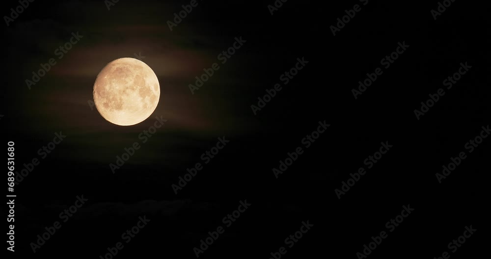 Moon in Dark Night Sky natural Background. video night nighttime . white and Yellow Moon. Shadow from clouds against moon. Moon in Dark Night Sky natural Background. video night nighttime . white and Yellow Moon. Shadow from clouds against moon.