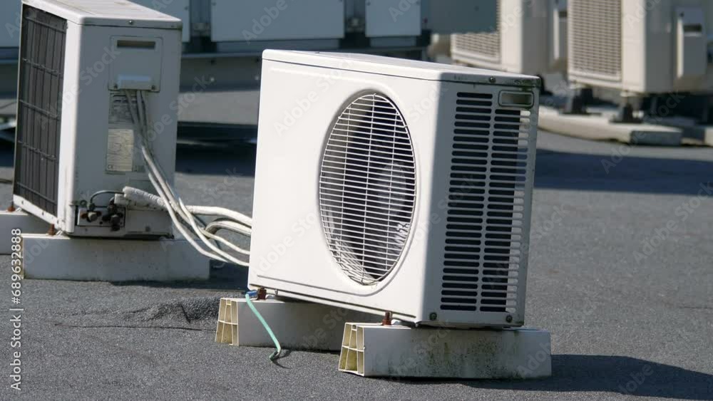 Modern Air Conditioning Units Installed on the Roof of a Commercial Building in 4k slow motion 60fps Modern Air Conditioning Units Installed on the Roof of a Commercial Building in 4k slow motion 60fps