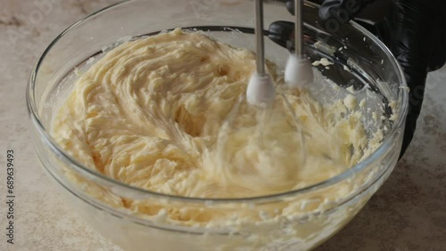 Whipping dough. Making cream or dough. Home cooking. Home cooking concept. Dynamic shooting