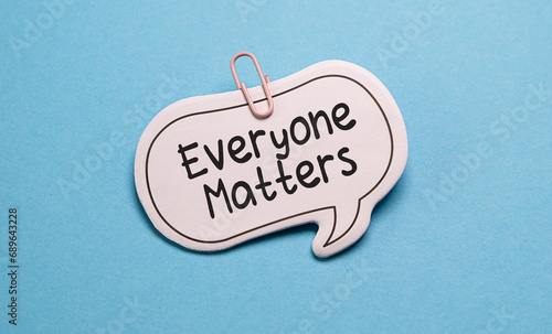 Everyone Matters text on card isolated on blue background photo