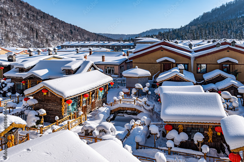 Φωτογραφία Landscape of houses and courtyards after snow in China's snow town