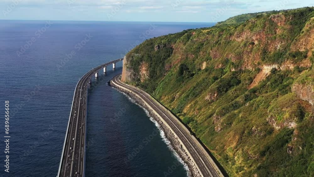 Aerial drone view of the new coastal road Route du Littoral connecting Saint Denis with La Possession, Reunion. Aerial drone view of the new coastal road Route du Littoral connecting Saint Denis with La Possession, Reunion.