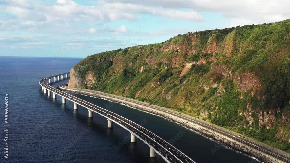 Aerial drone view of the new coastal road Route du Littoral connecting Saint Denis with La Possession, Reunion. Aerial drone view of the new coastal road Route du Littoral connecting Saint Denis with La Possession, Reunion.