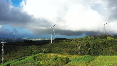 Aerial drone view of windmills, fields and rainforest, Sainte Suzanne, Reunion. photo