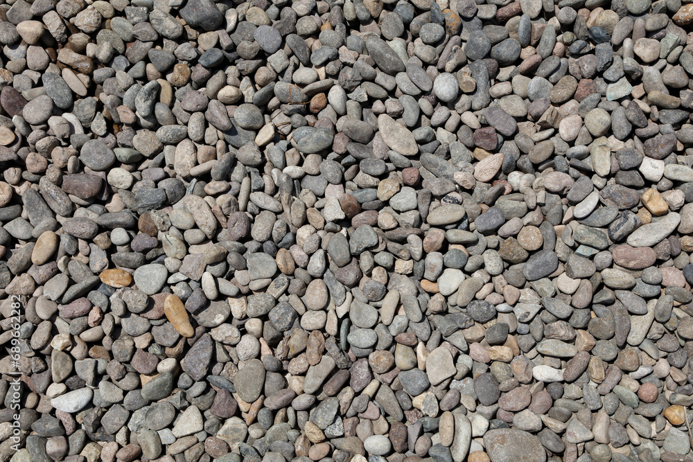 Textured patterns of gravel, stones, and rubble on asphalt, outdoors.
Textured patterns of gravel, stones, and rubble on asphalt, outdoors.