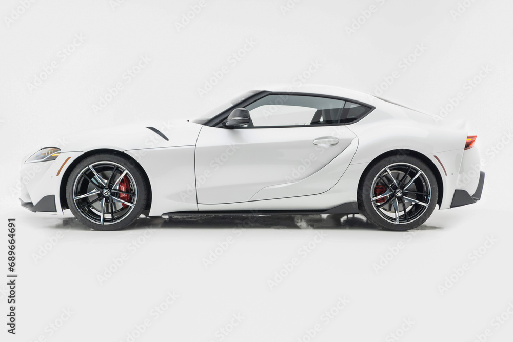 White Toyota Supra side view isolated on white background - High