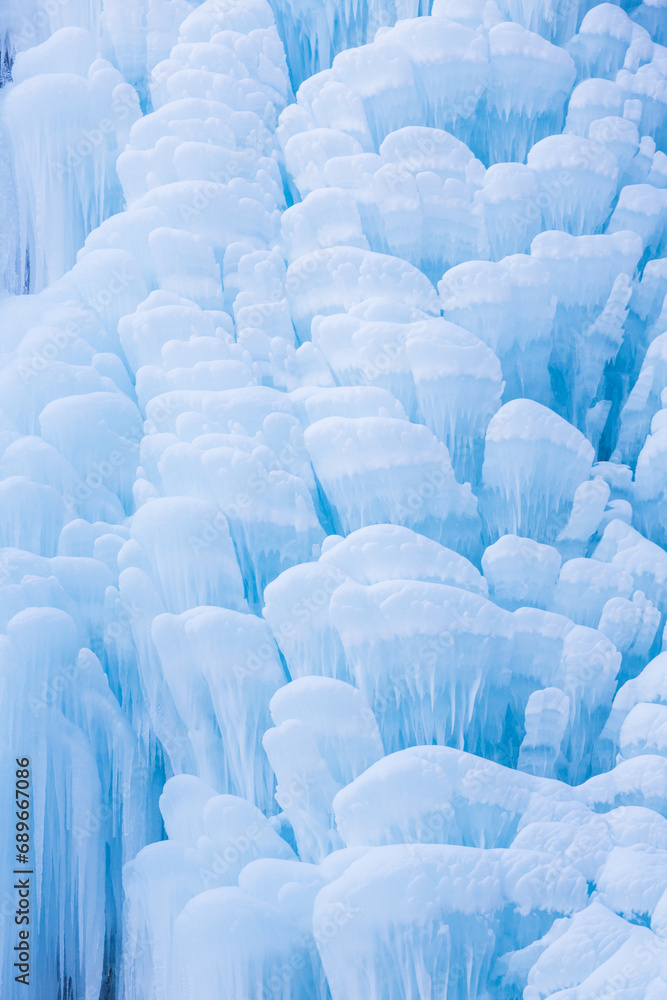 Obraz premium Water falls forming intricate icicle formations in Caucasus, Russia. Close-up, detail