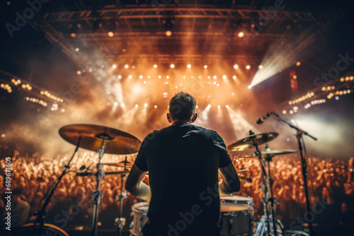 A drummer on stage during a concert, creating a vibrant musical atmosphere with dynamic lighting, engaging the crowd