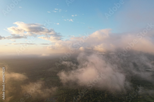 Fototapeta Naklejka Na Ścianę i Meble -  Fluffy clouds over natural landscape