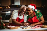 Joyful senior African-American couple cooks Christmas dinner at home. Happy black wife and husband prepare delicious food for family holiday. Positive people at table with treats in kitchen