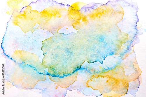 Abstract liquid art background. Blue yellow watercolor translucent blots on white paper.