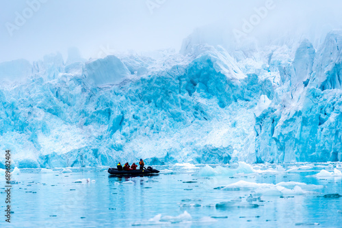 A group of tourist visiting a glacier in Svalbard