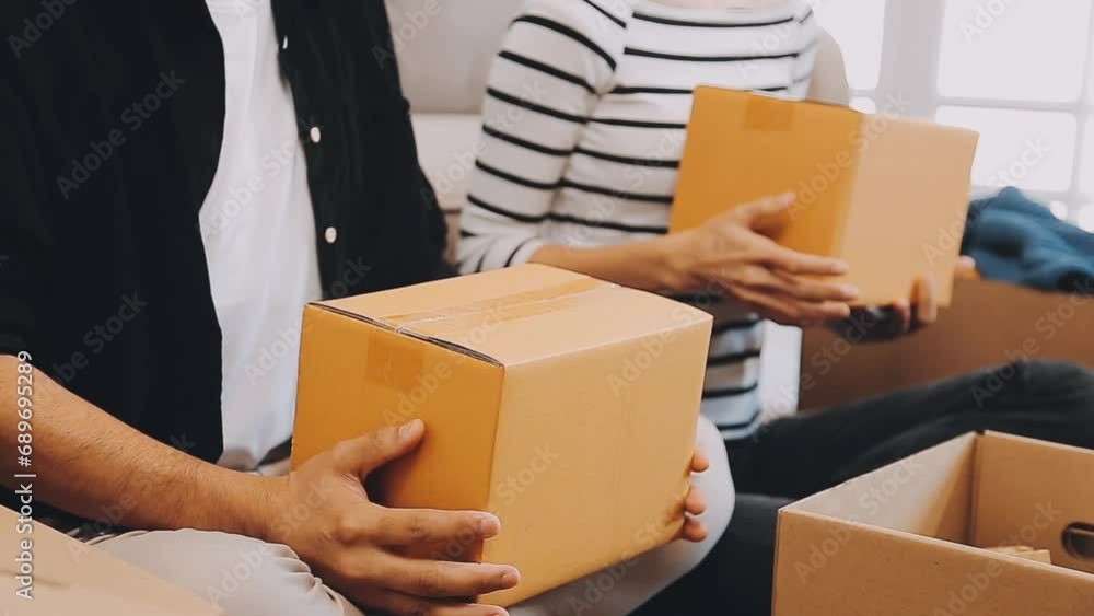 Startup small business SME, Entrepreneur owner using smartphone or tablet taking receive and checking online purchase shopping order to preparing pack product box. Selling online ideas concept Startup small business SME, Entrepreneur owner using smartphone or tablet taking receive and checking online purchase shopping order to preparing pack product box. Selling online ideas concept