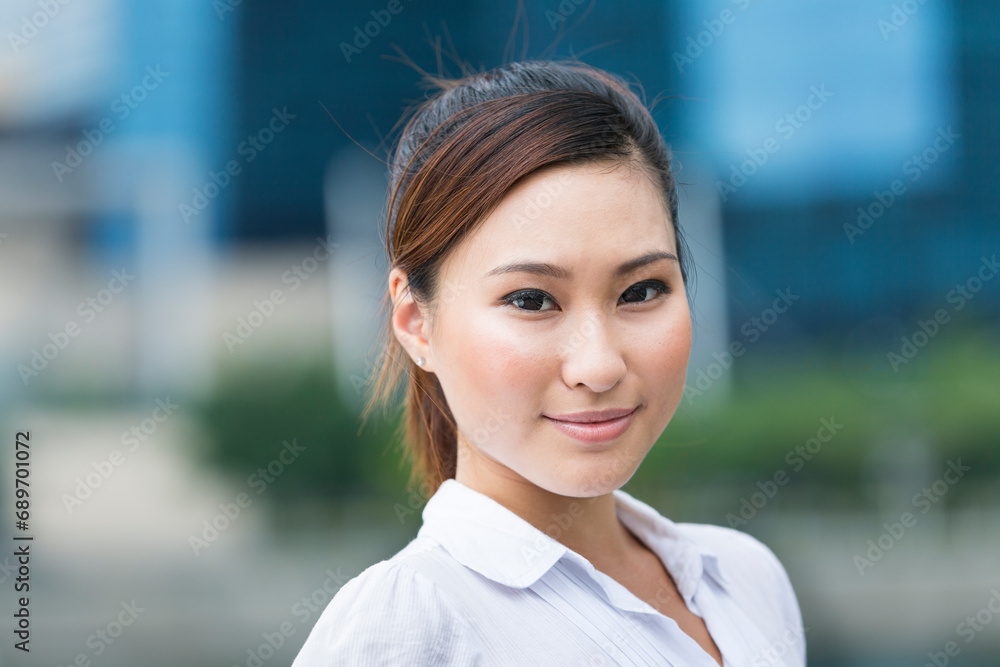 Chinese Businesswoman standing in the city. Chinese Businesswoman standing in the city.