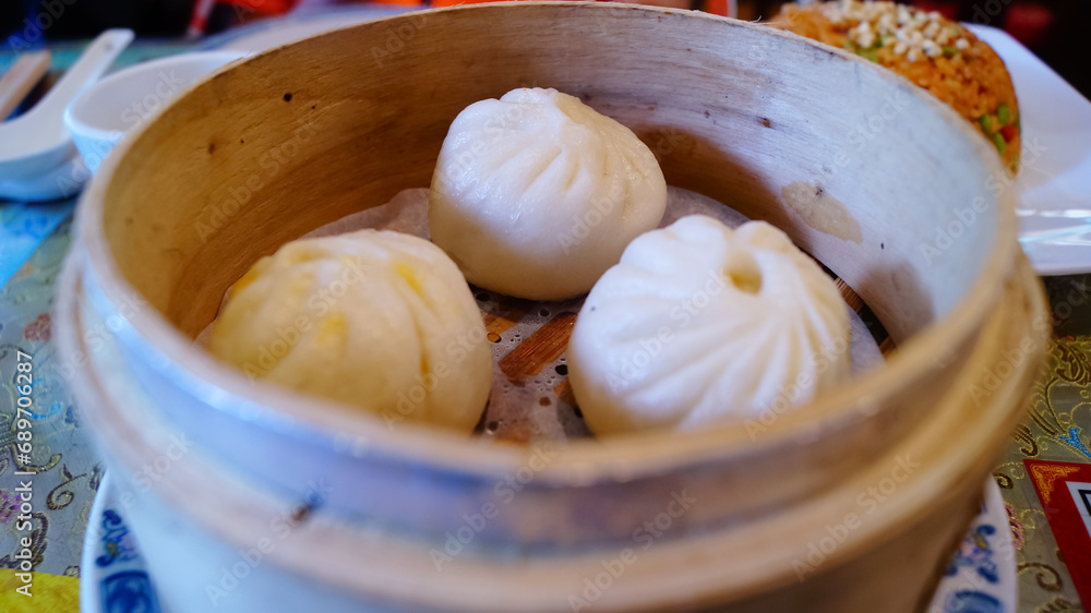 Close-up of the steamed prawn dumplings. Chinese traditional dim sum. Chinese food cultures. Chinese traditional food. Food concept. Close-up of the steamed prawn dumplings. Chinese traditional dim sum. Chinese food cultures. Chinese traditional food. Food concept.