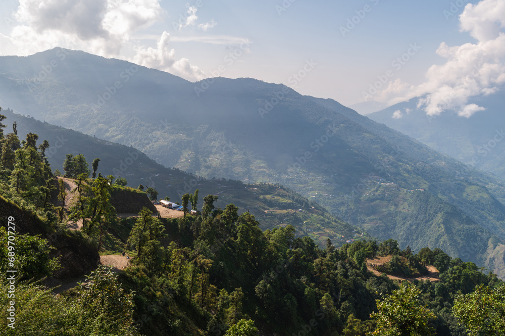 Terraced farming in Nepal. Village on a terraced hill during trekking through Kari la pass on EBC or Three passes trek in Himalayas.