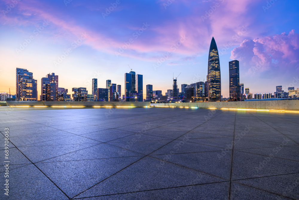 City square and skyline with modern buildings in Shenzhen at sunset, Guangdong Province, China. Famous commercial buildings in Shenzhen.