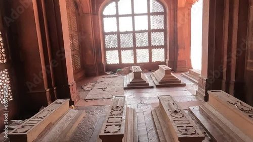 Video of walking through grave stones of women in a corridor in Fatehpur Sikri. photo