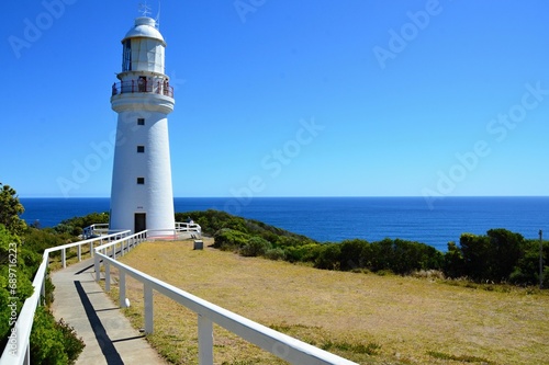 A white lighthouse on the rocky coast of the Pacific Ocean at the Cape of Good Hope South Australia near Melbourne,