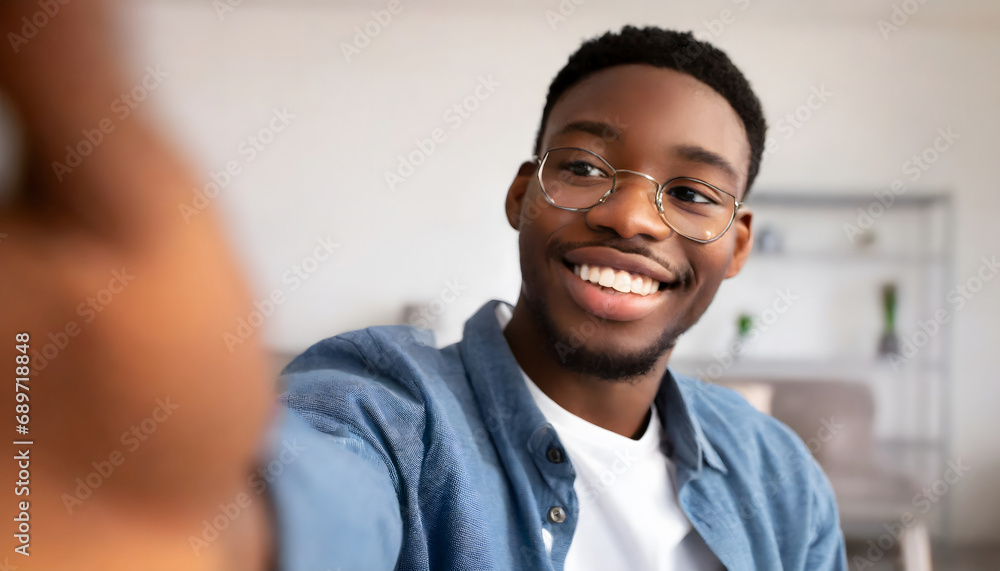 African boy smiling taking a selfie African boy smiling taking a selfie