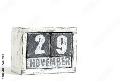 November 29 on wooden calendar, on white background.