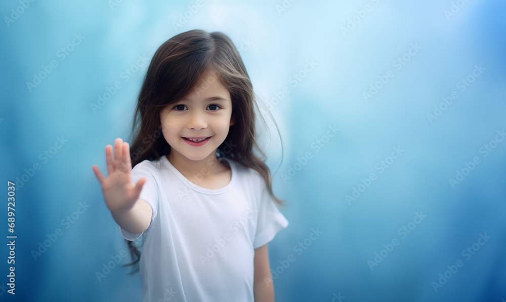Little asian girl wearing white t-shirt with no branding showing the stop sign with hand in studio Little asian girl wearing white t-shirt with no branding showing the stop sign with hand in studio