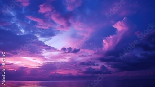 Deep purple magenta violet navy blue sky. Dramatic evening sky with clouds. Colorful sunset background for design. Dark shades. Cloudy weather. Storm. Fantasy fantastic. © Santy Hong