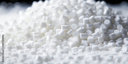 White Plastic Resin Pellets. Factory Manufactured PVC Granules for Thermoplastic Production. Ecology and Manufacturing Concepts photo