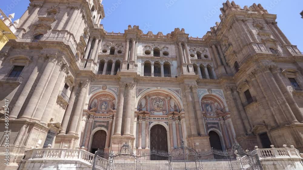 Facade of spectacular cathedral of Malaga. Situated in old town center, The Cathedral of Málaga is a Roman Catholic church, constructed between 1528 and 1782, in the Renaissance architectural style. Facade of spectacular cathedral of Malaga. Situated in old town center, The Cathedral of Málaga is a Roman Catholic church, constructed between 1528 and 1782, in the Renaissance architectural style.