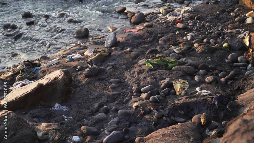 Garbage and dirt on the beach, plastic bottles. An environmental disaster Garbage and dirt on the beach, plastic bottles. An environmental disaster