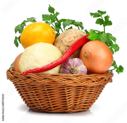 Vegetables in basket isolated on white background