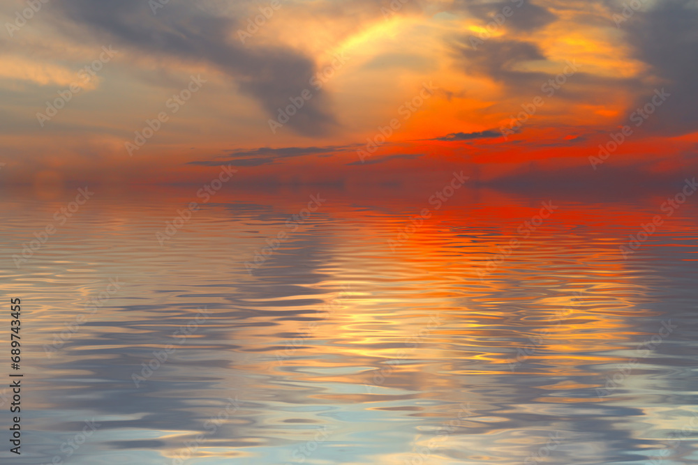 A horizontal image of a sunset over the ocean, where the iridescent rays of the sun penetrate the clouds and reflect on the calm surface of the water, creating a peaceful atmosphere. This image can be