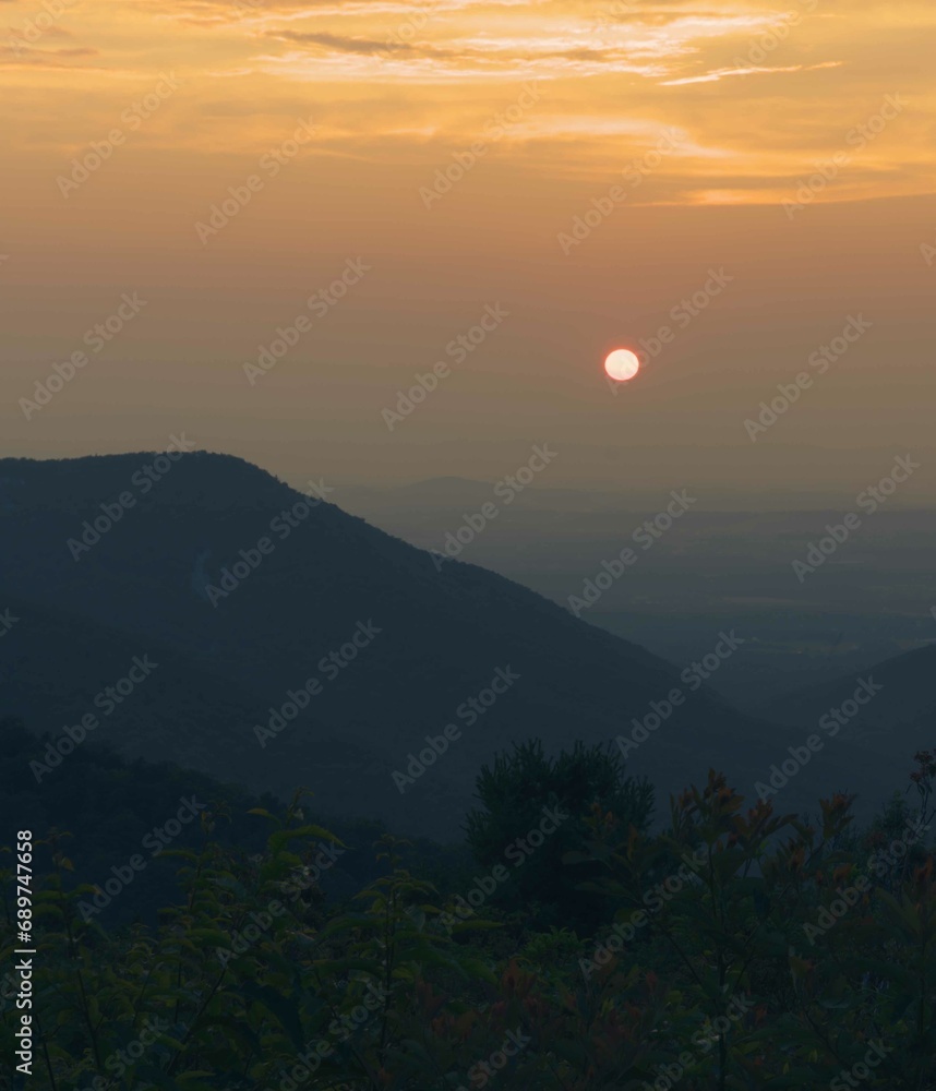 Abstract summer sunset in the Blue Ridge Mountains during blue hour. Abstract summer sunset in the Blue Ridge Mountains during blue hour.