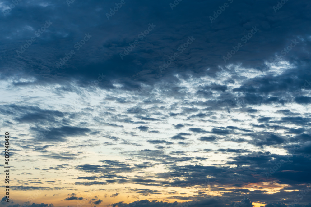Sunset on blue sky. Blue sky with some clouds. blue sky clouds, summer skies, cloudy blue sky Sunset on blue sky. Blue sky with some clouds. blue sky clouds, summer skies, cloudy blue sky