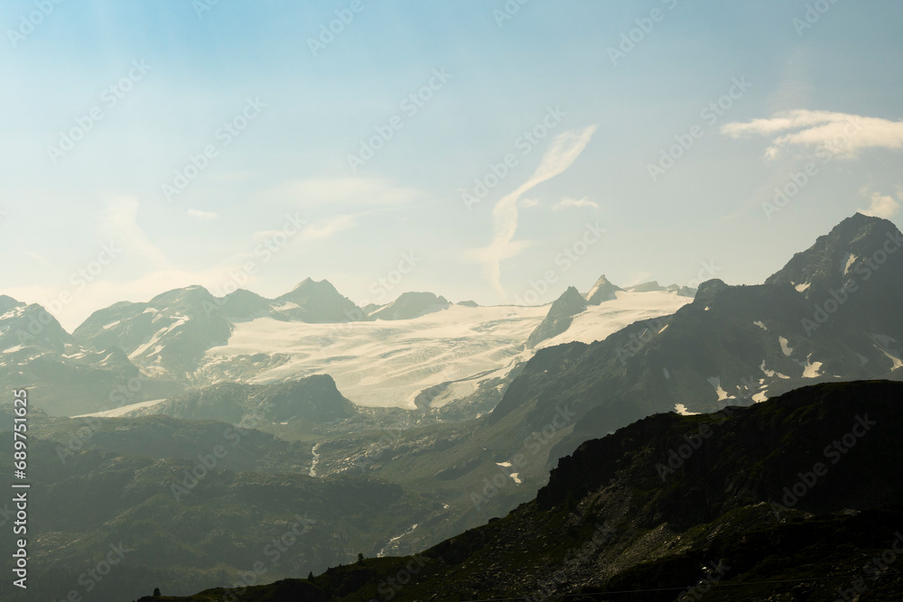 Fototapeta premium Summer Splendor: Peaks, Ice, Rocks, and Lakes. Alps. Aosta Valley. Italy.
