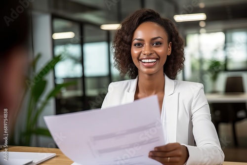 Fototapeta Naklejka Na Ścianę i Meble -  Smiling business woman hr holding cv at job interview. Happy mid aged professional banking financial manager, insurance agent, lawyer consulting clients sitting at work corporate office meeting