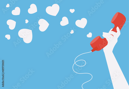 Female hand holding old style retro phone with heart shapes flying out. Blue horizontal background with place for your text. Valentine card, wedding invitation, promo sale banner template.