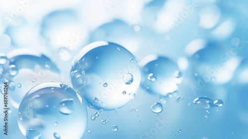 Close-up macro photo of water drops or oil bubbles on blue background.