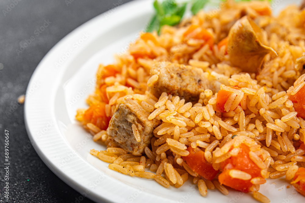 rice pilaf meat tasty fresh pork meat eating cooking appetizer meal food snack on the table copy space food background rustic top view rice pilaf meat tasty fresh pork meat eating cooking appetizer meal food snack on the table copy space food background rustic top view