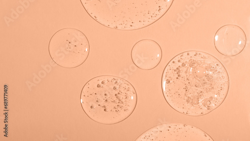 Tableau sur toile Top view of liquid cosmetics gel with bubbly structure on pastel background