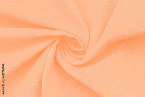 Textured background trendy color of 2024 peach fuzz.